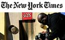 The New York Times logo with a picture of military personnel taking a photo.
